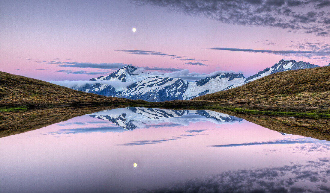 Mount Aspiring, moonrise at dusk over Cascade Saddle, Mount Aspiring National Park, New Zealand