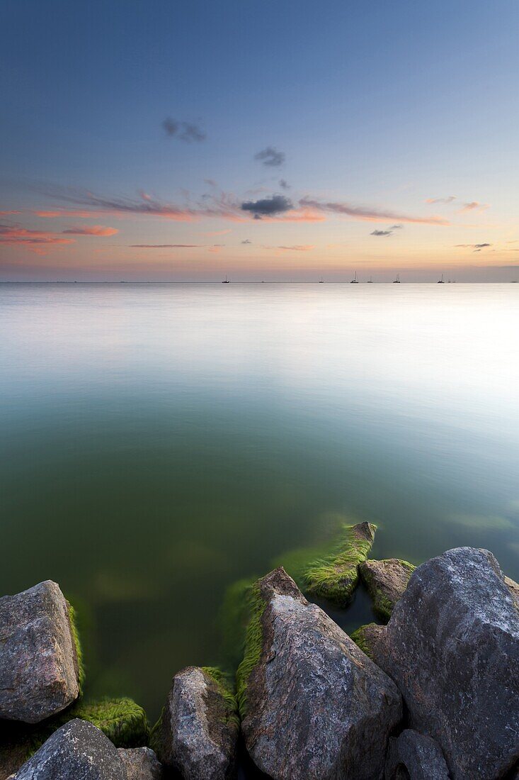 Sunset at the dam of the Ijsselmeer, Stavoren, Netherlands