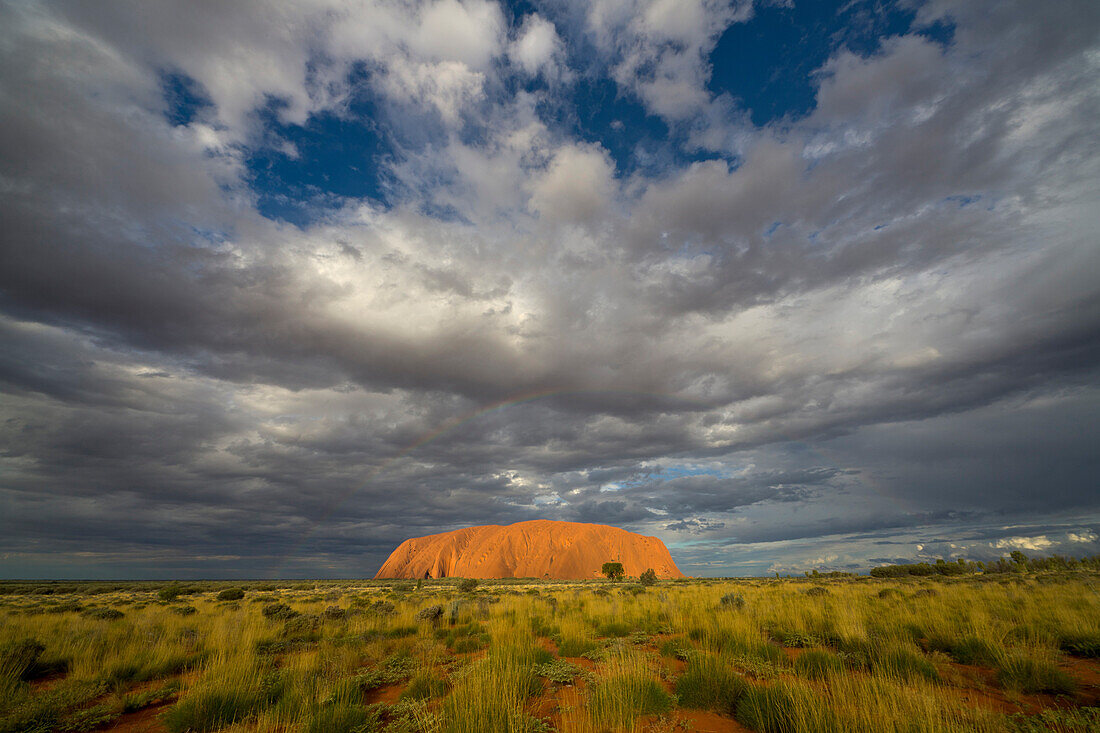 Ayers Rock and storm clouds, Uluru-kata Tjuta National Park, Northern Territory, Australia