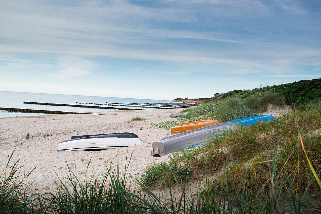 View of small fishing boats on the beach in the dunes, Wustrow, Mecklenburg Vorpommern, Germany