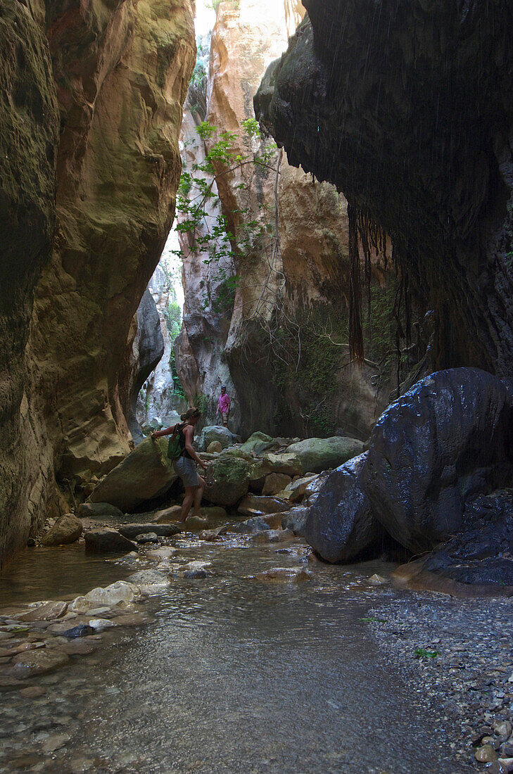 hikers in a narrow gorge, in the Avakas gorge, Akamas peninsula, Paphos distict, Cyprus