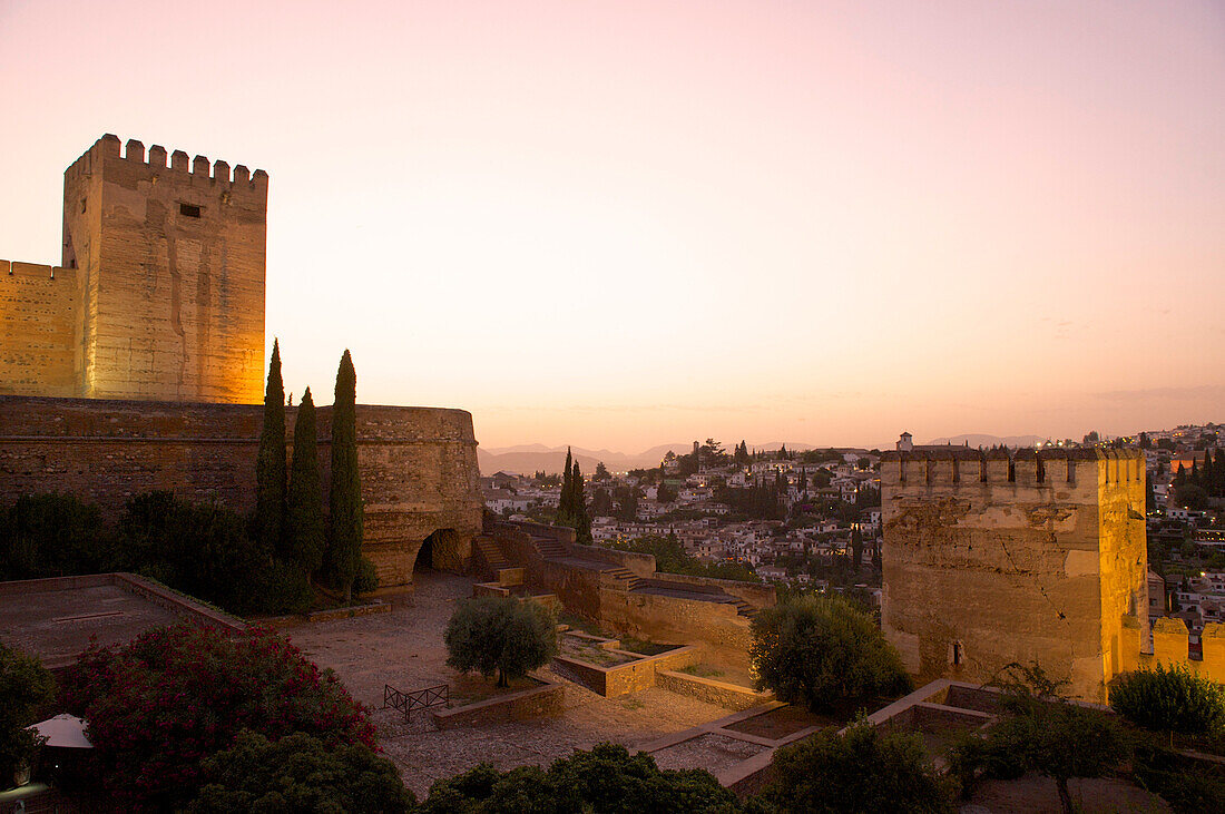 Towers of the Alhambra fortress and view over Granada in the evening, Granada, Andalusia, Spain