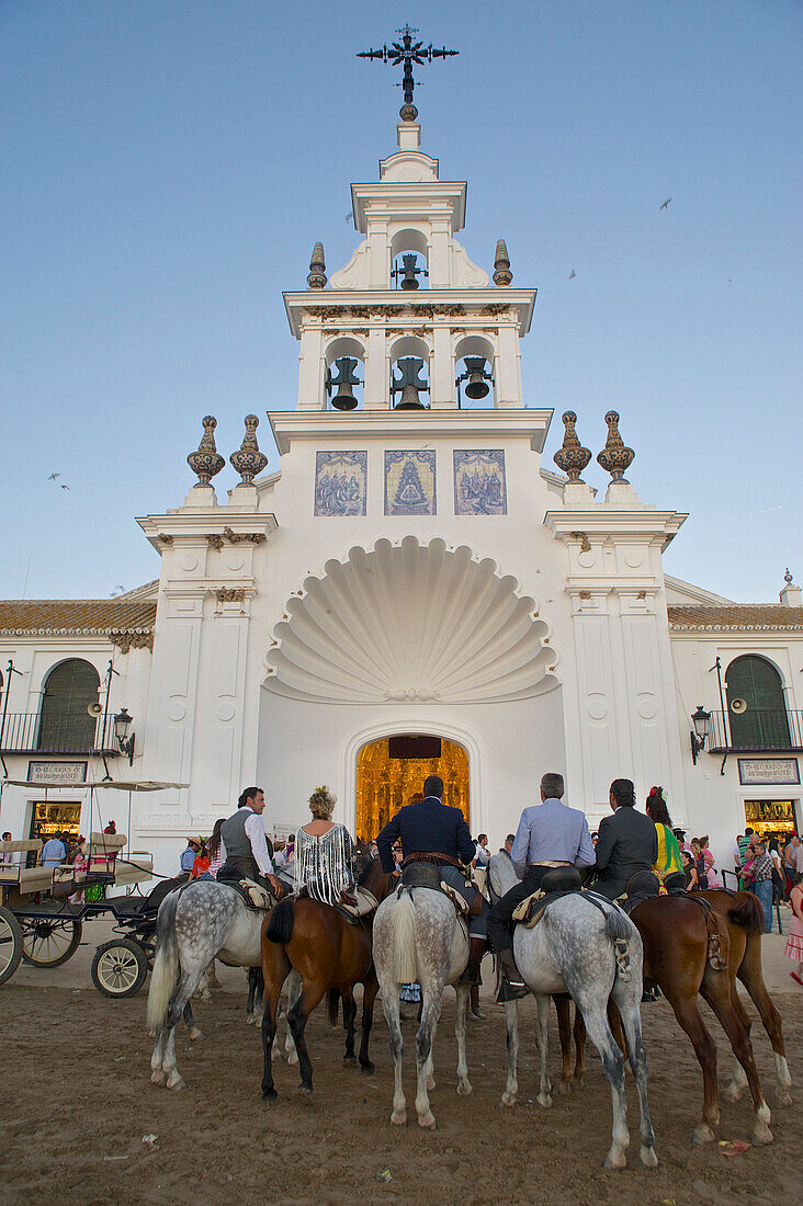 Pilgrims  on horseback in front of the church Eremita del Rocio at El Rocio at Pentecost, Huelva, Andalusien, Spanien