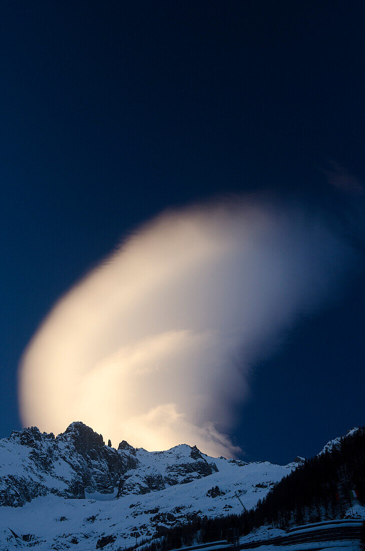 A cloud over the summits on the south side of Mont Blanc, Graian Alps, Italy