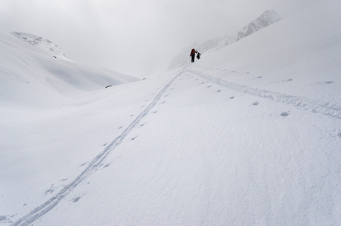 The tracks of two backcountry skiers merging, ascent towards the Col des Roux and the Cabane de Prafleuri, Pennine Alps, canton of Valais, Switzerland