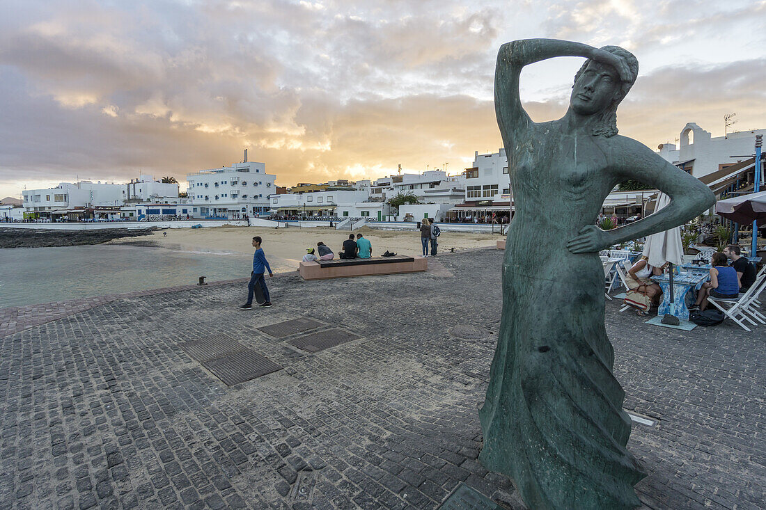 Corralejo Beach at Sunset with sculpture, Fuerteventura, Canary Islands, Spain