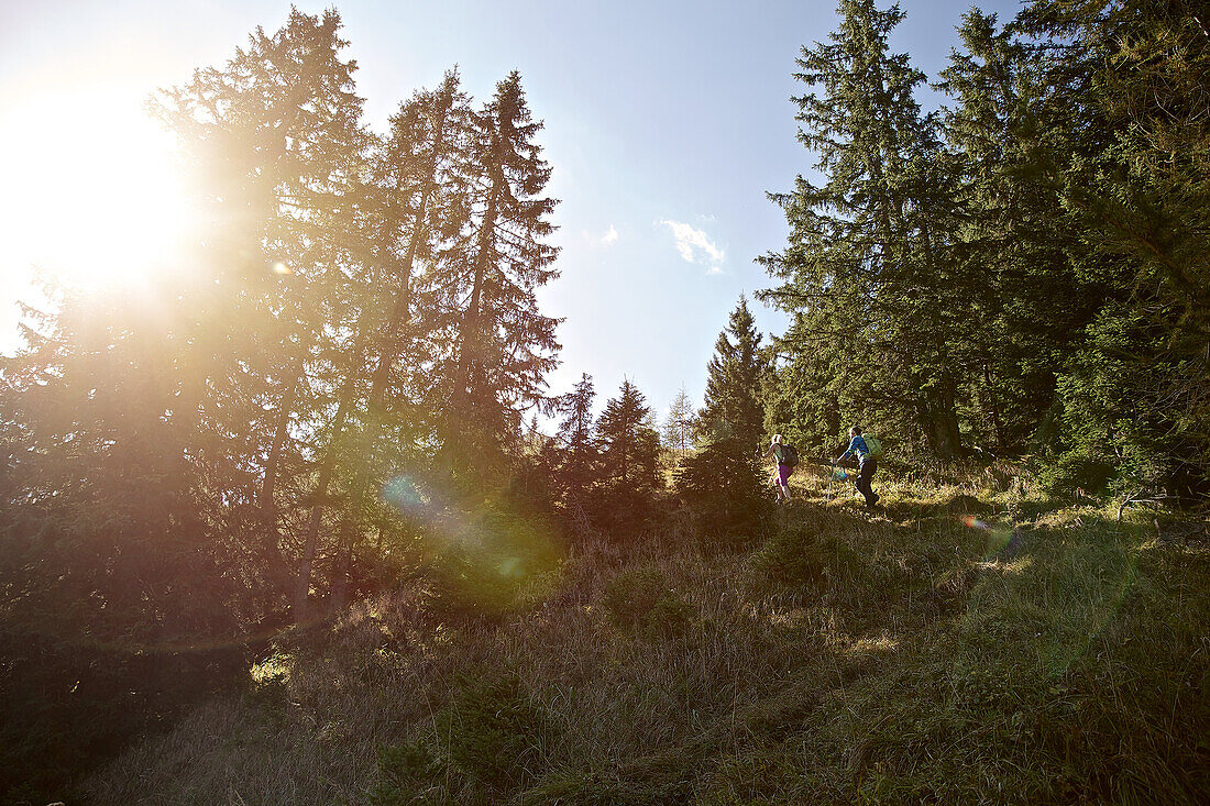 A man and a woman hiking in the mountains, Oberstdorf, Bavaria, Germany