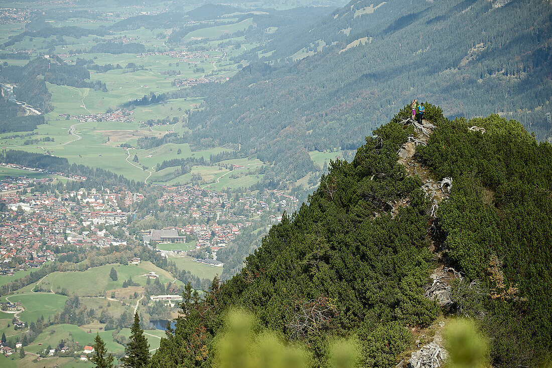 A man and a woman hiking in the mountains, Oberstdorf, Bavaria, Germany