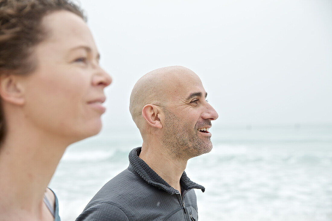 Young couple standing at the sea, Mallorca, Spain