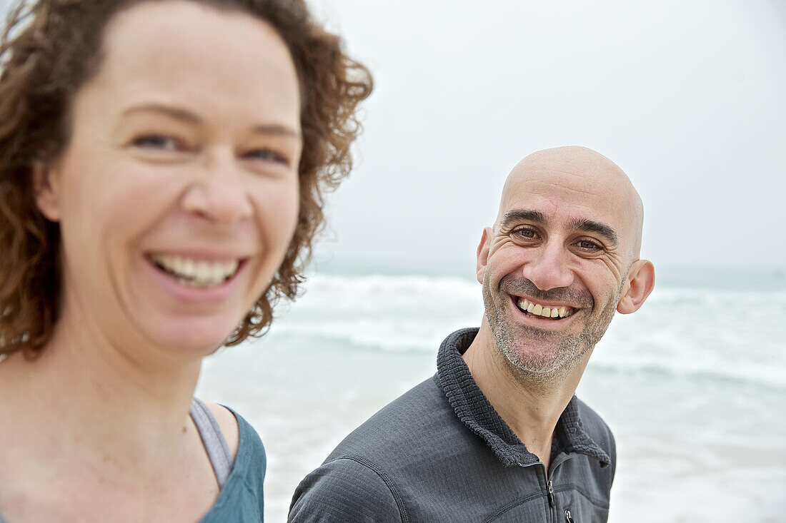 Young couple standing at the sea, Mallorca, Spain