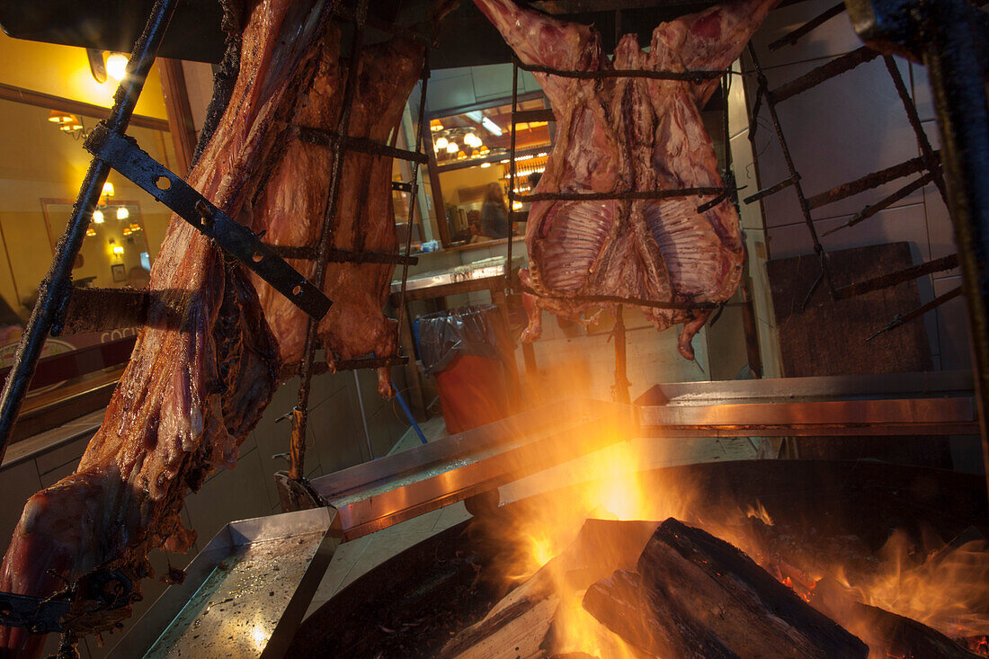 Lamb asada grills at La Estanca Parrilla steak restaurant, Ushuaia, Tierra del Fuego, Patagonia, Argentina