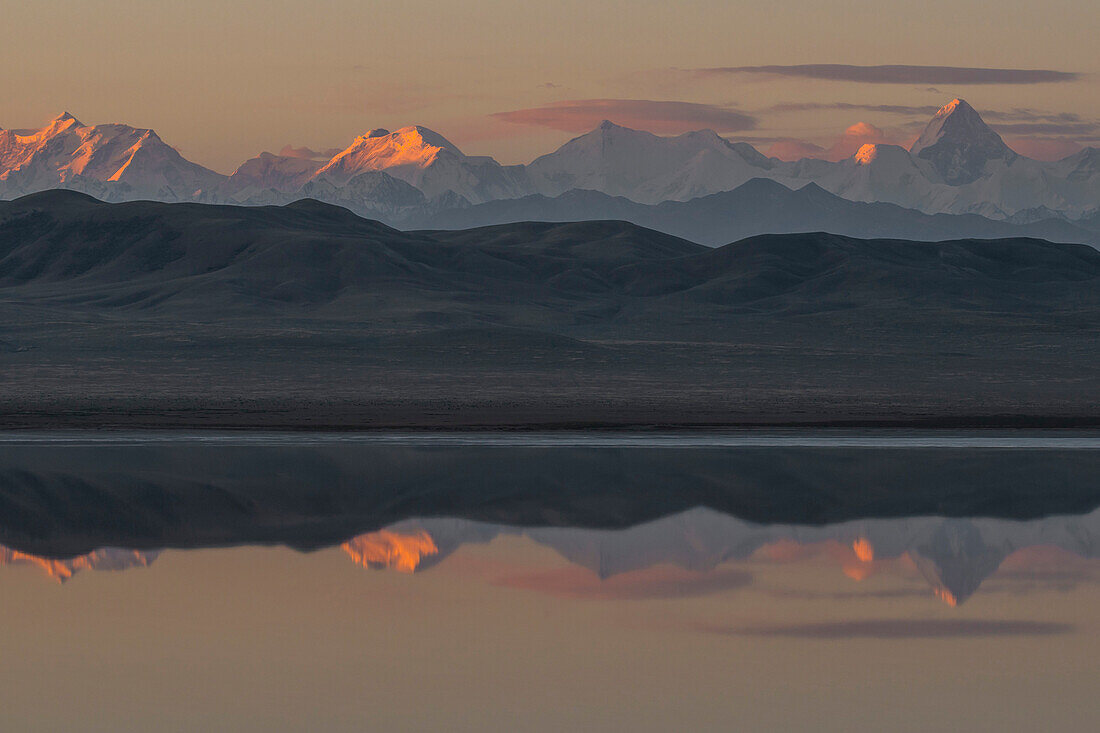 Reflection of tallest Tien Shan peaks among them Khan Tengri, Peak Pobeda, Mramornaya Stena, Schatry, Peak Bajankol, Peak Tschapajev, Peak Semjonov at sunset, Tuzkoel Salt Lake, Tuzkol, Tien Shan, Tian Shan, Almaty region, Kazakhstan, Central Asia, Asia