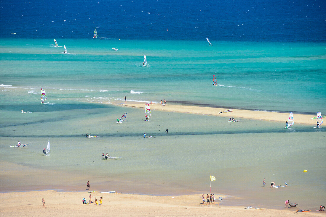 Surfers and bathing vistitors at the beach, Playas de Sotavento de Jandia, Risco del Paso, Fuerteventura, Canary Islands, Spain