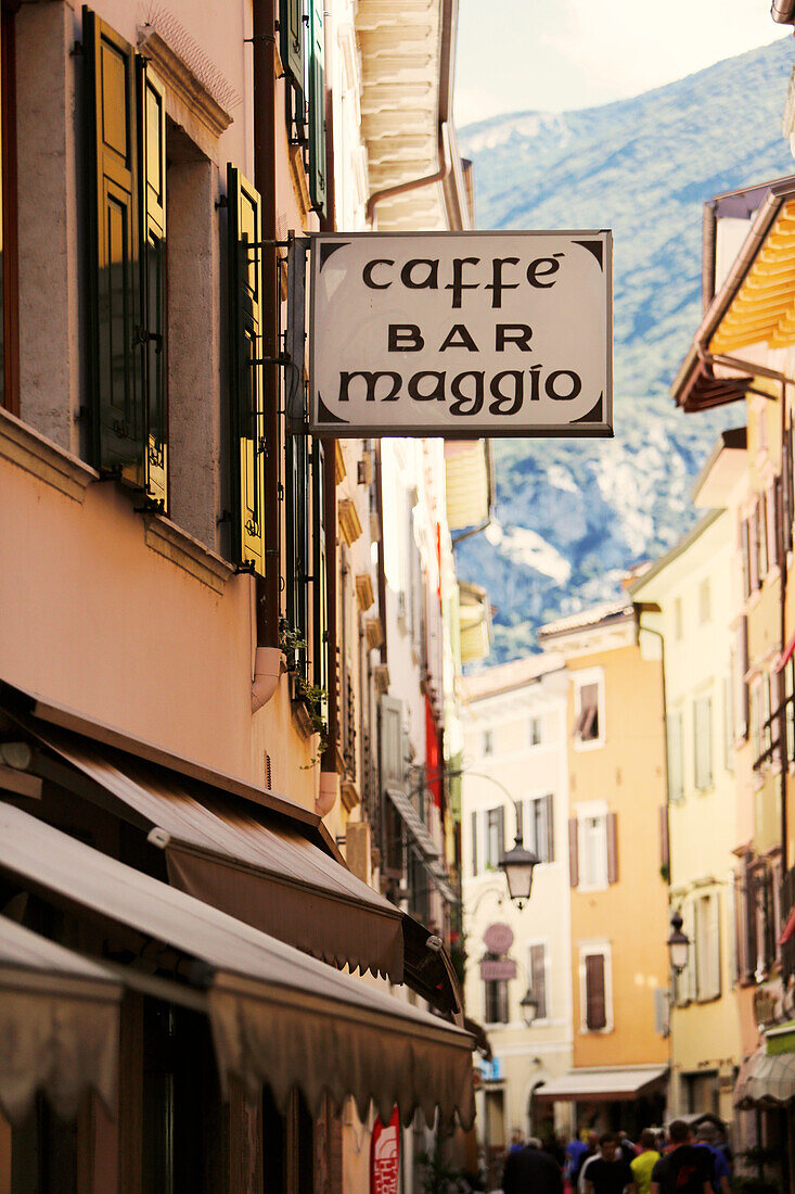 Cafe and bar sign in a lane in the old town, Arco, Trentino, Italy