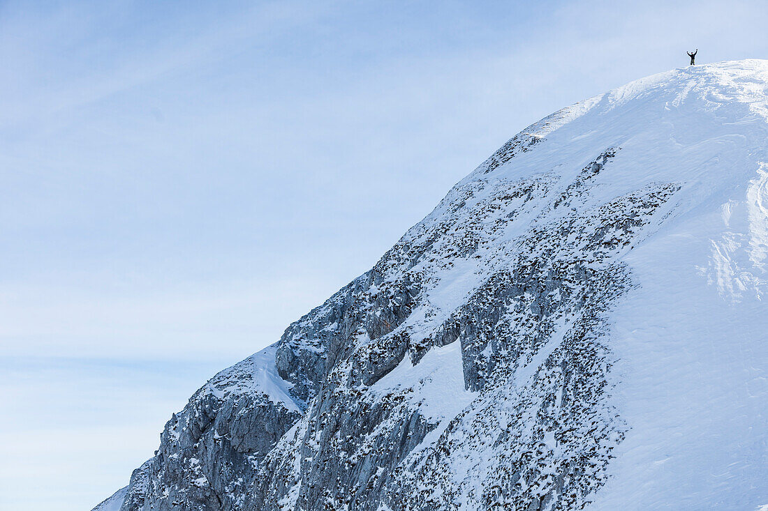 Backcountry skier on Sonntagskogel peak, Tennengebirge mountains, Salzburg, Austria