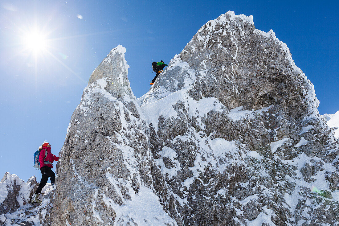 young couple rock climbing in Winter, Hochwannig, Mieminger Berge, Ehrwald, Tirol, Austria