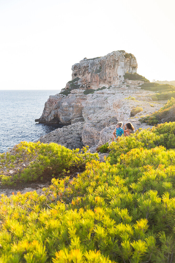 Coastal landscape and bay, Calo des Moro, tourists, Mediterranean Sea, near Santanyi, Majorca, Balearic Islands, Spain, Europe