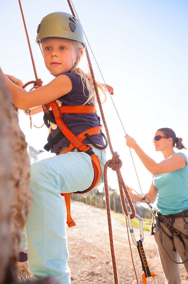 Girl rock climbing, Port de Soller, Serra de Tramuntana, Majorca, Balearic Islands, Spain, Europe