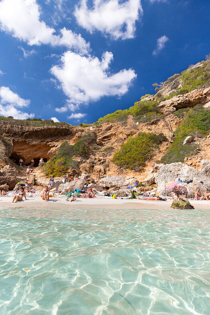 tourists on the beach, bay with turquoise blue sea, near Calo des Moro, Mediterranean Sea, near Santanyi, Majorca, Balearic Islands, Spain, Europe