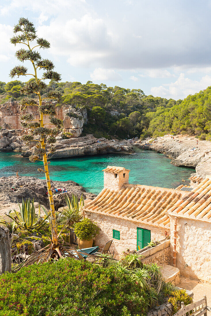Small house in a bay with turquoise blue sea, Cala s'Almunia, near Calo des Moro, Mediterranean Sea, near Santanyi, Majorca, Balearic Islands, Spain, Europe