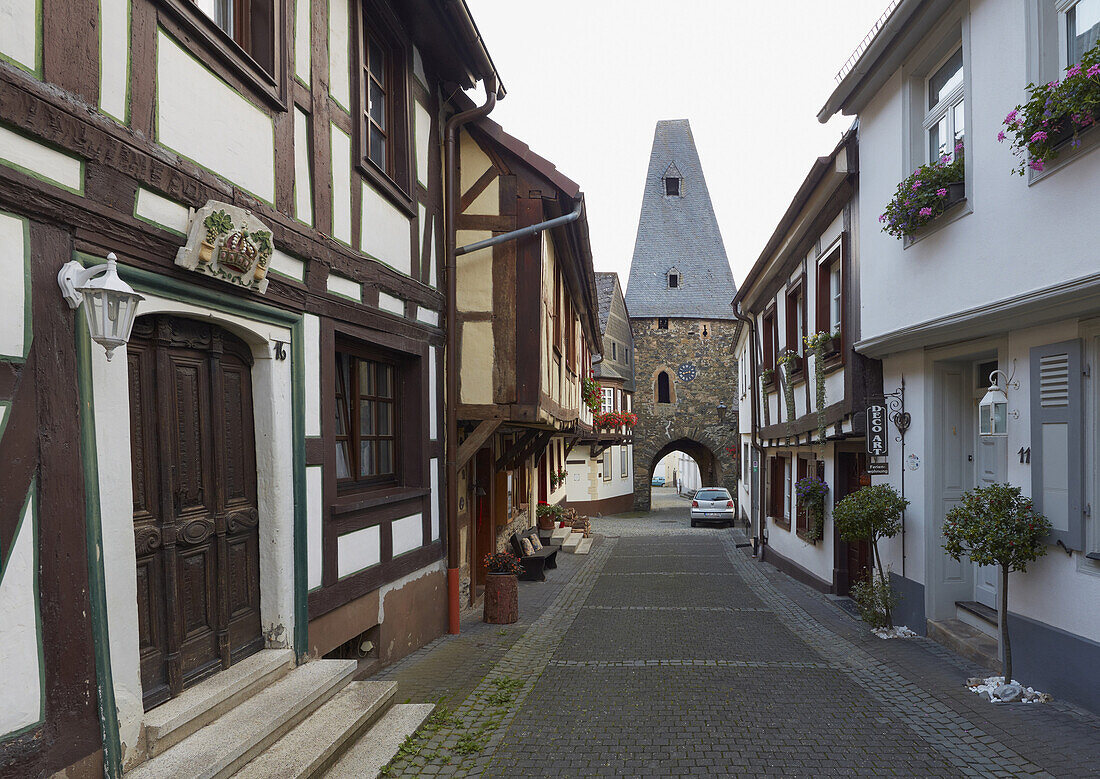 Half-timbered houses and gateway of the 12th century clock tower in Herrstein, Administrative district of Birkenfeld, Region of Hunsrueck, Rhineland-Palatinate, Germany, Europe