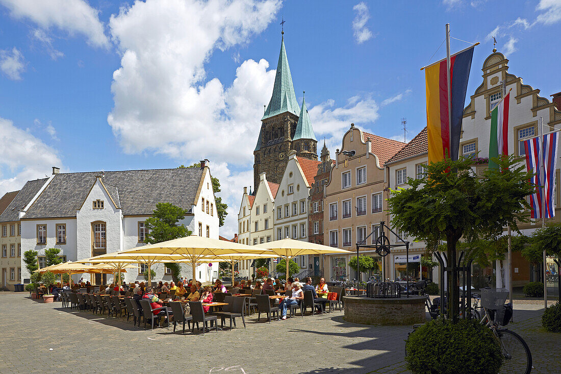 Town hall and open air cafés and restaurants at the market place at Warendorf , Muensterland , North Rhine-Westphalia , Germany , Europe