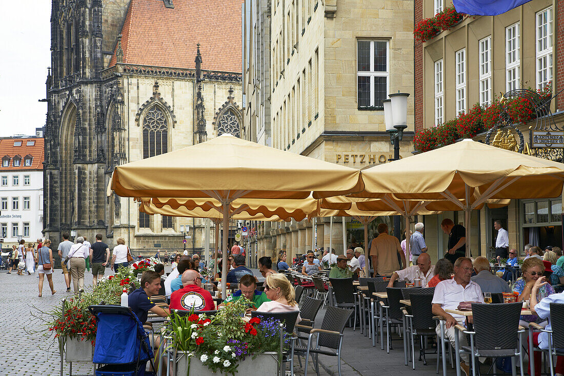 St. Lambert's Church and restaurants at Prinzipalmarkt , Muenster , Muensterland , North Rhine-Westphalia , Germany , Europe