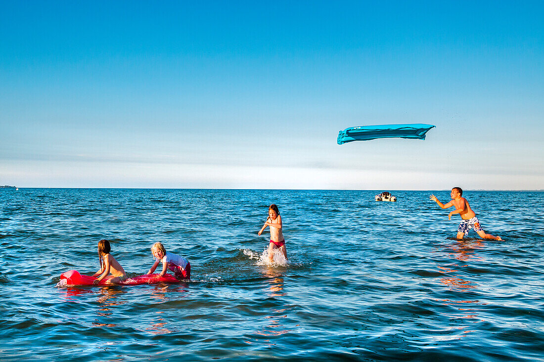 Children playing in the sea, Scharbeutz, Baltic Coast, Schleswig-Holstein, Germany