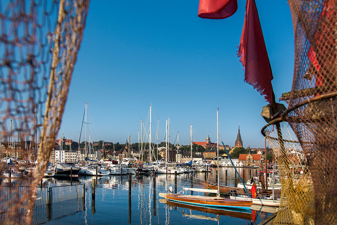 View through a fishing net towards the old town, Flensburg, Baltic Coast, Schleswig-Holstein, Germany