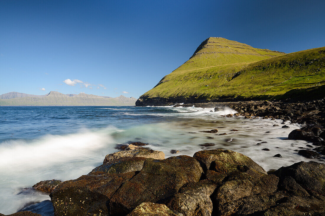 Breakwater at the rocky beach in the bay of Gjogv, Eysturoy Island, Faroe Islands