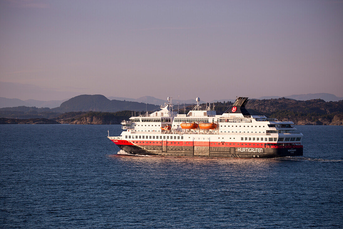 Hurtigruten cruise and postal ship Nordkapp in fjord passage, near Bergen, Hordaland, Norway