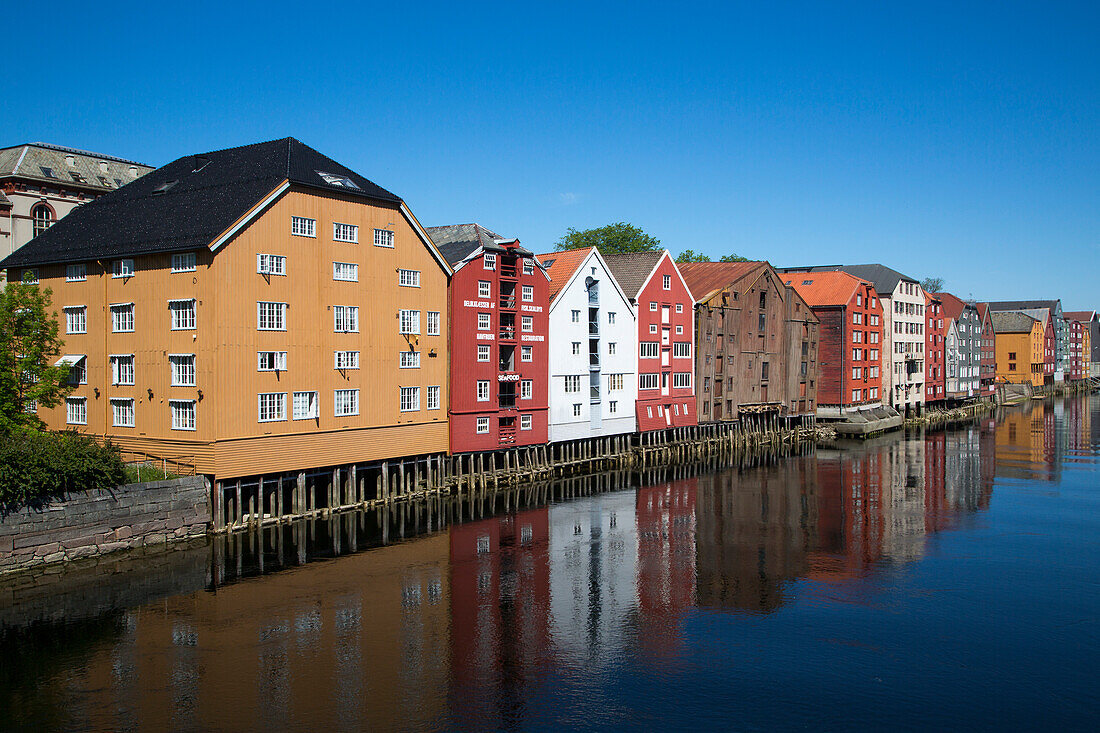 Colorful buildings of historic wharves along river Nidelva, Trondheim, Sør-Trøndelag, Norway