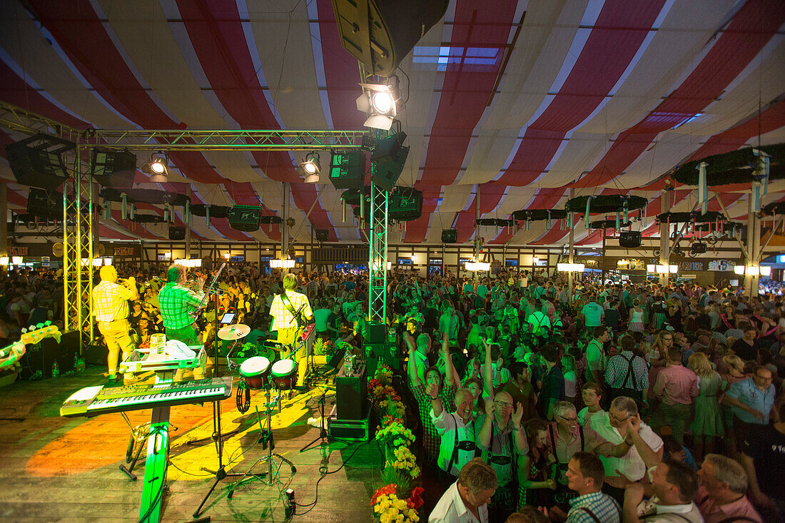 People party to music by band Die Wilderer inside Stadel beer tent during Kulmbacher Bierwoche beer festival, Kulmbach, Franconia, Bavaria, Germany