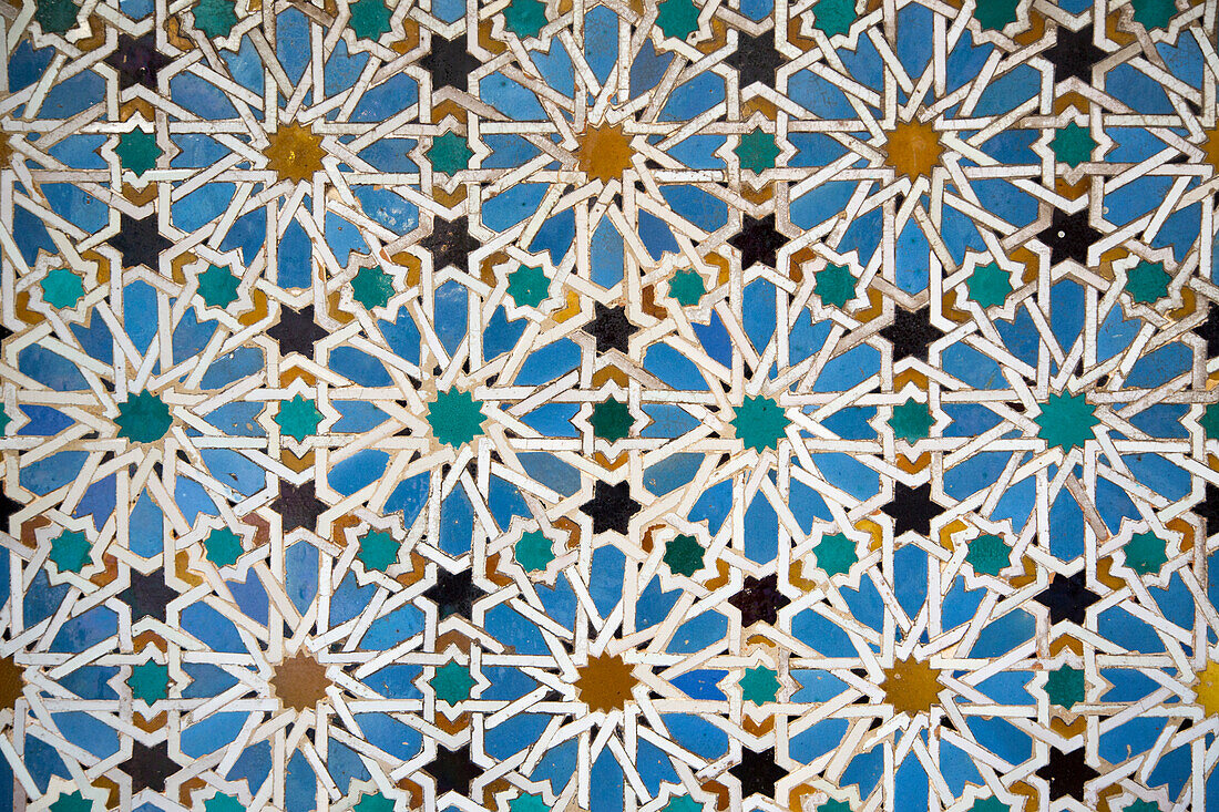 Mudejar tiles with Moorish geometric patterns  on wall of Alcazar, Seville, Andalusia, Spain