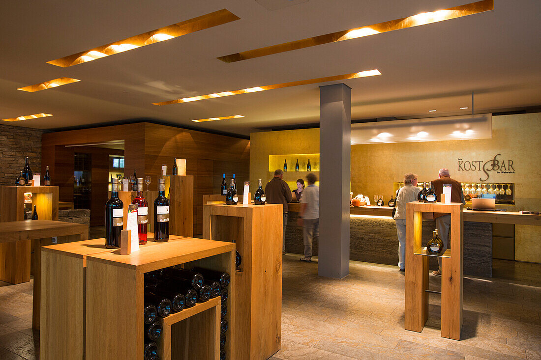 People sample wines in Weinreich wine tasting room at Winzerkeller Sommerach winery, Sommerach, Franconia, Bavaria, Germany