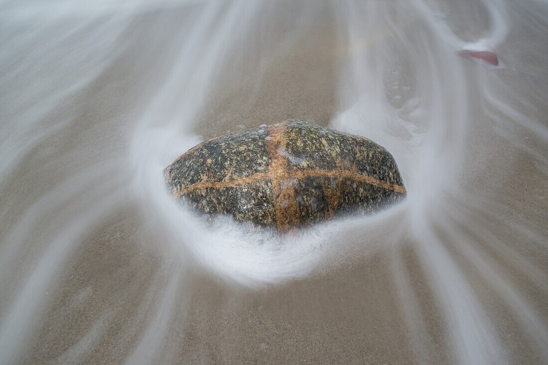 Round polished pebbles on the Baltic Sea beach in the Western Pomerania Lagoon Area National Park, Ahrenshoop, Fischland-Darss-Zingst, Mecklenburg-Western Pomerania, Germany