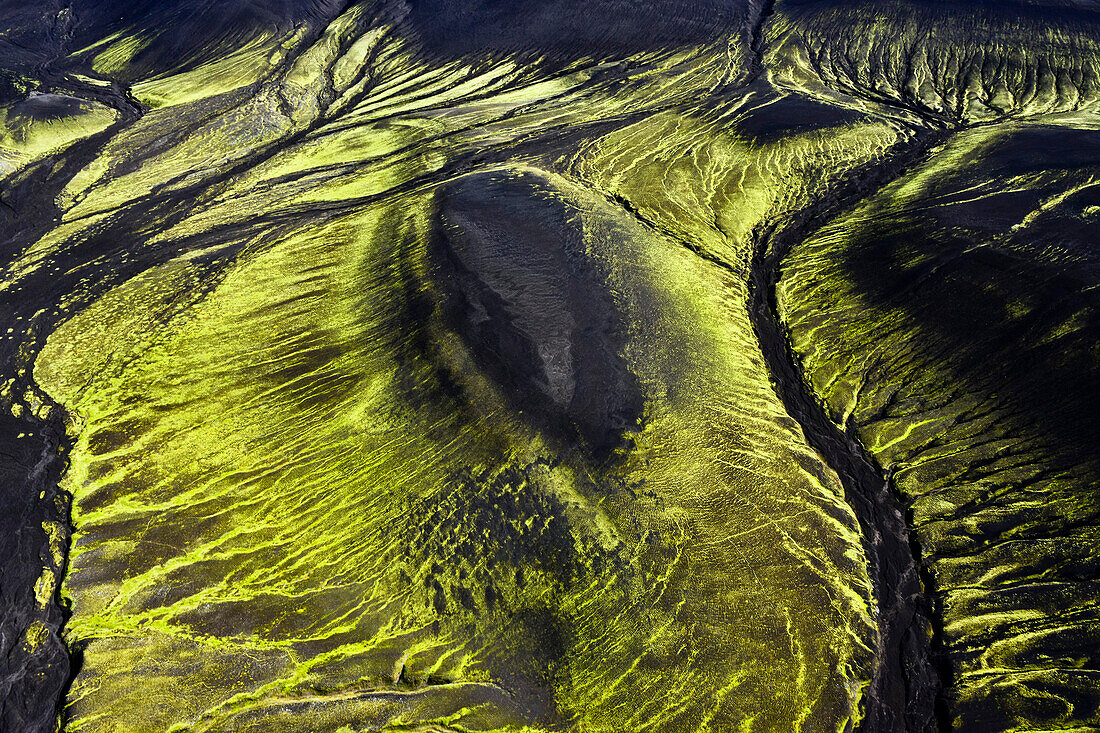 Aerial view of volcanic dark mountains covered with fluorescent mosses, Veidivotn, Highlands, South Iceland, Iceland, Europe
