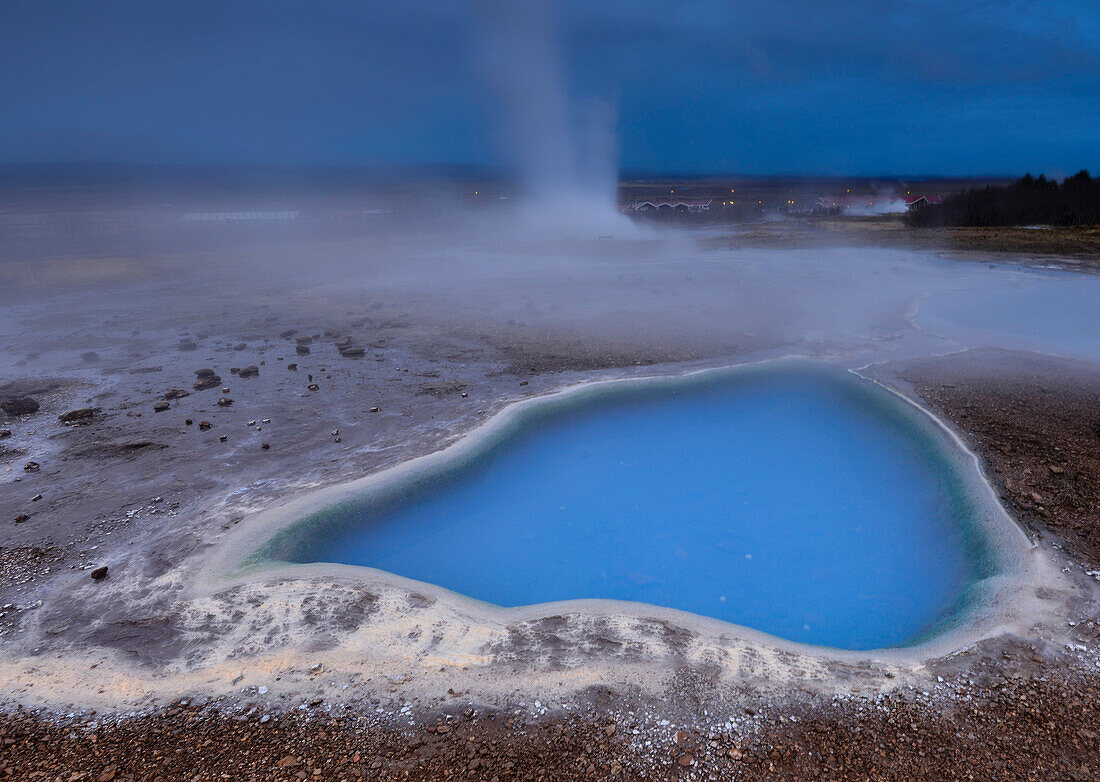 Geyser Strokkur at eruption and turquoise hot spring Blesi, Haukadalur valley, Blaskogabyggd, Golden Circle, Southern Iceland, Iceland, Europe