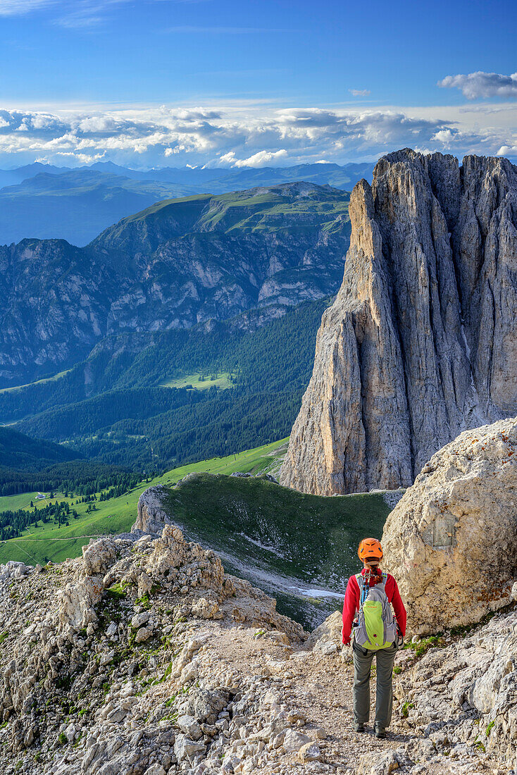 Woman descending on fixed rope route from Rotwand, Rotwand, Rosengarten, UNESCO world heritage Dolomites, Dolomites, Trentino, Italy