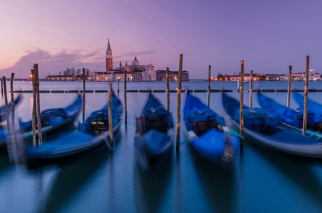 Blurred view of gondolas on urban canal, Venice, Veneto, Italy, Venice, Veneto, Italy