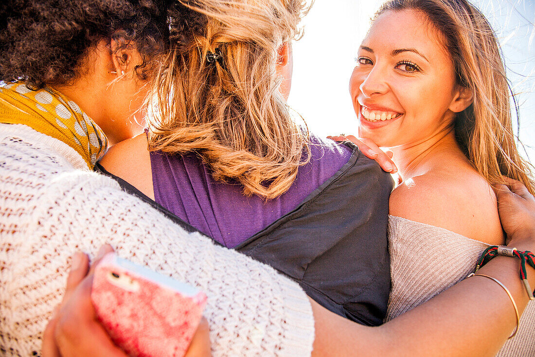 Women standing together outdoors, Oakland, California, United States