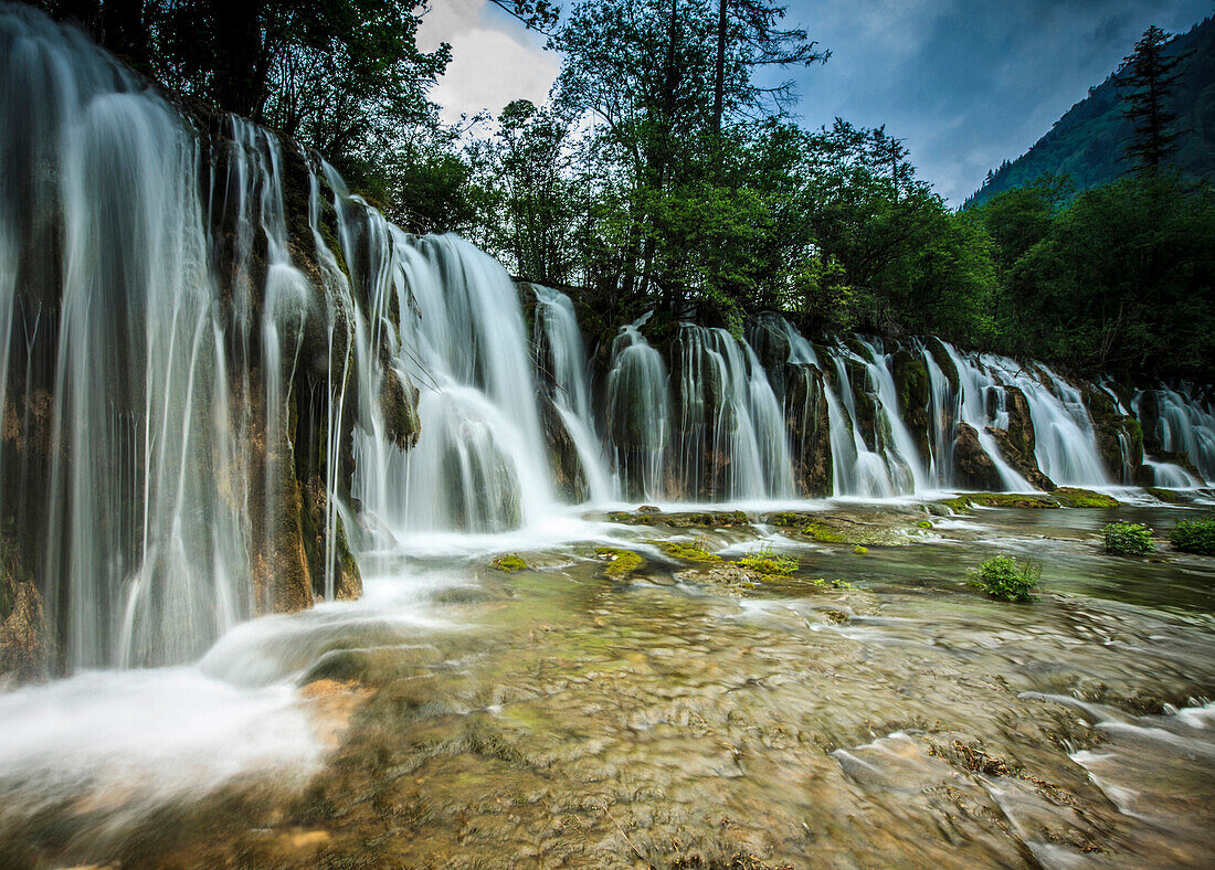 Waterfall in rural landscape, Jiuzhaigou, Sichuan, China
