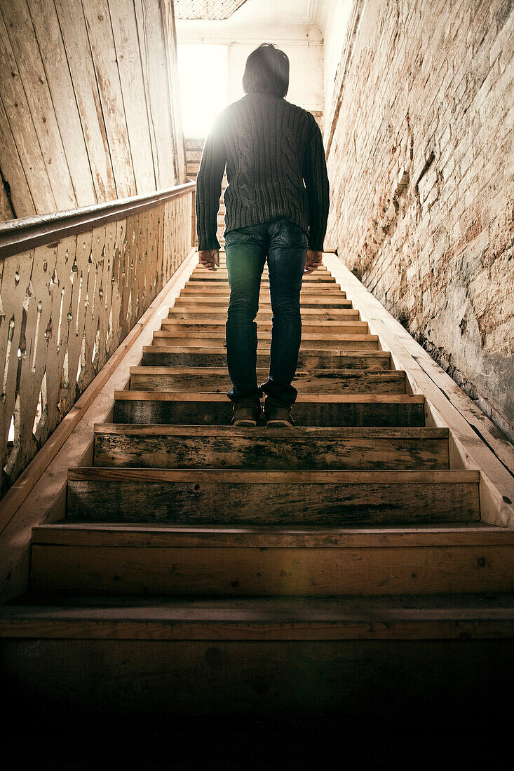 Mari man standing on staircase, Nizhniy Tagil, Sverdlovsk region, Russia