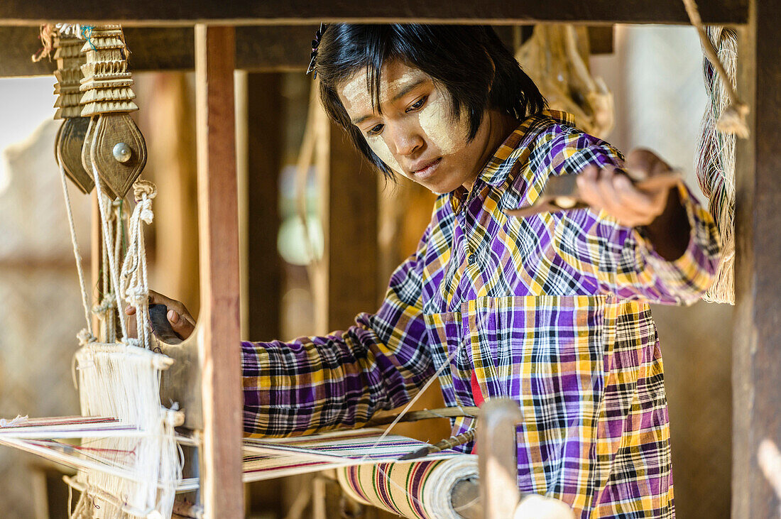 Asian girl weaving fabric, Bagan, Mandalay, Myanmar