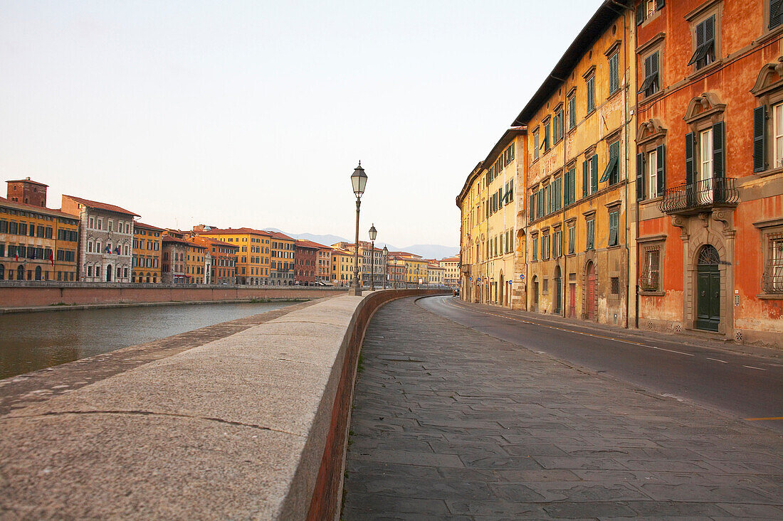 Walkway on urban riverfront, Pisa, Toscano, Italy, Pisa, Toscano, Italy