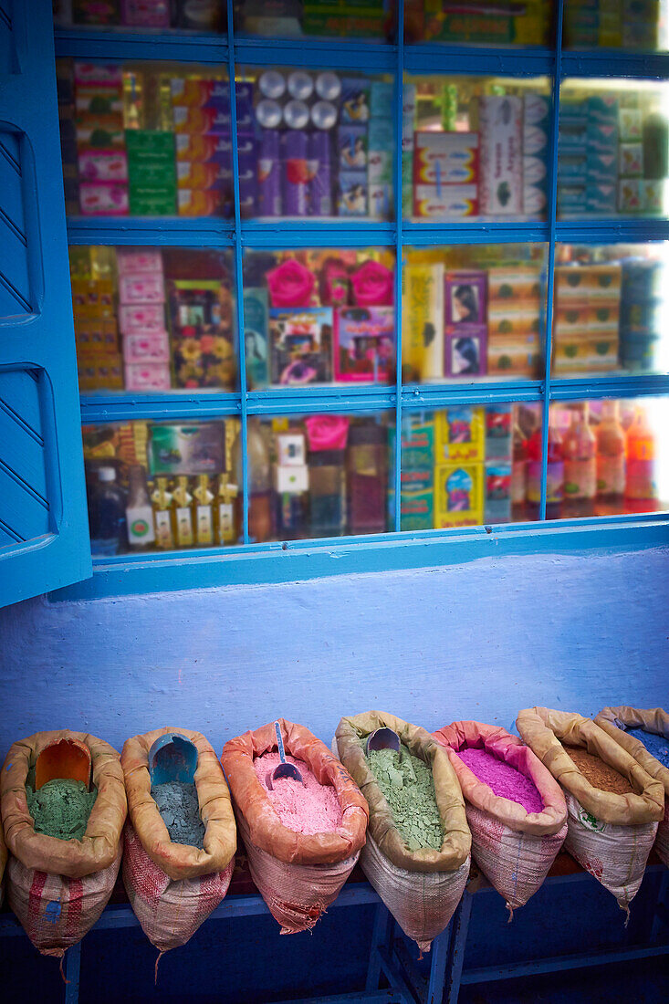 Baskets of colorful powders on historical village street, Chefchaouen, Chefchaouen, Morocco