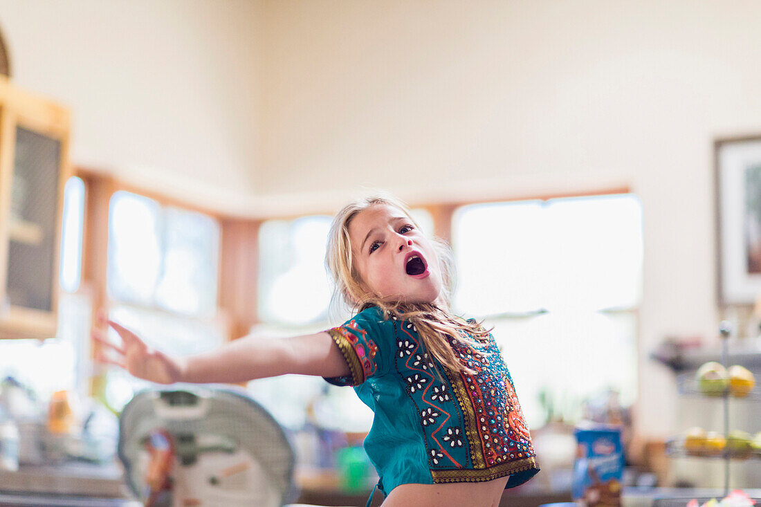 Caucasian girl singing indoors, Santa Fe, New Mexico, USA