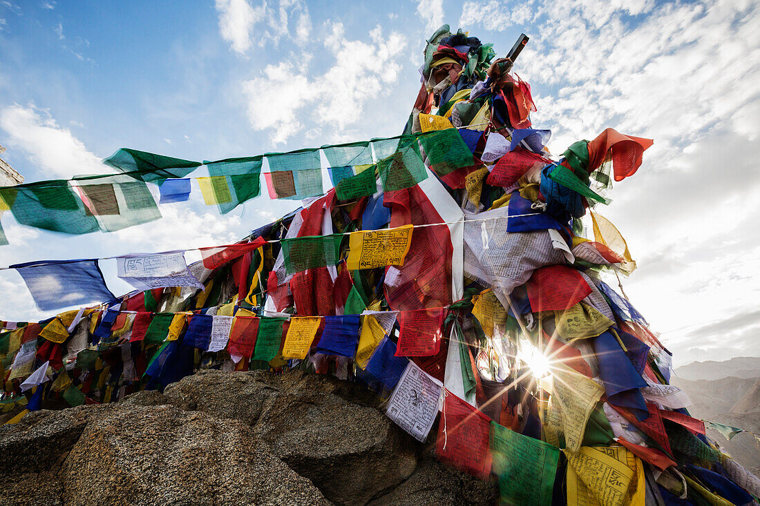 Low angle view of colorful prayer flags on monastery wall, Leh, Ladakh, India