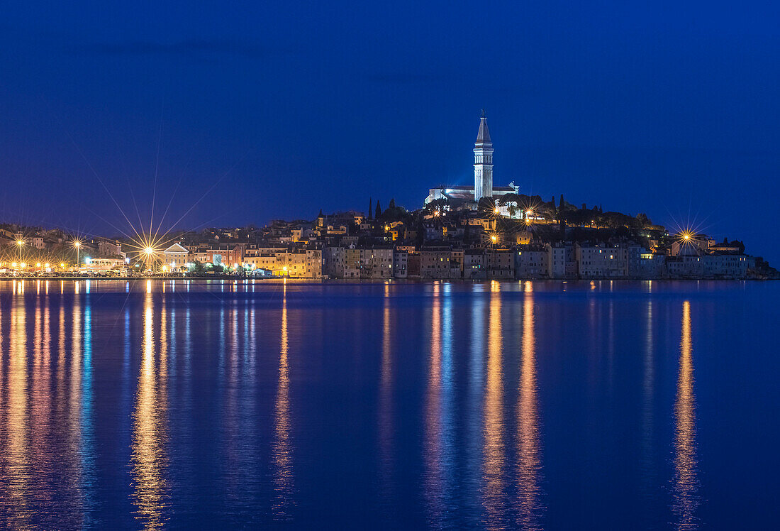 Illuminated coastal city reflected in still water, Rovinj, Istria, Croatia, Rovinj, Istria, Croatia