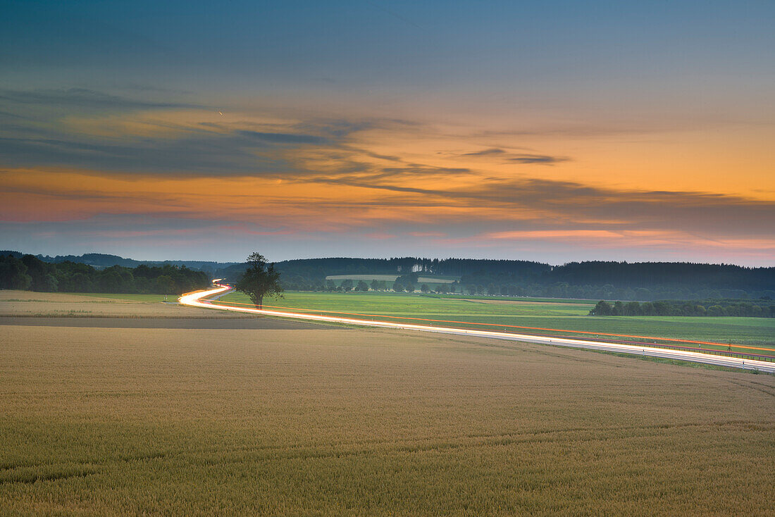 Evening sky in Puchheim overlooking the main road B2 towards Fuerstenfeldbruck, Puchheim, Bavaria, Germany